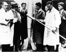 Hermann Oberth tests early rocket. von Braun at right