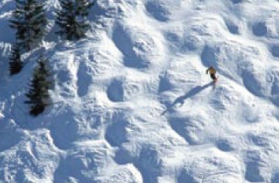 Bumps at slope with skier